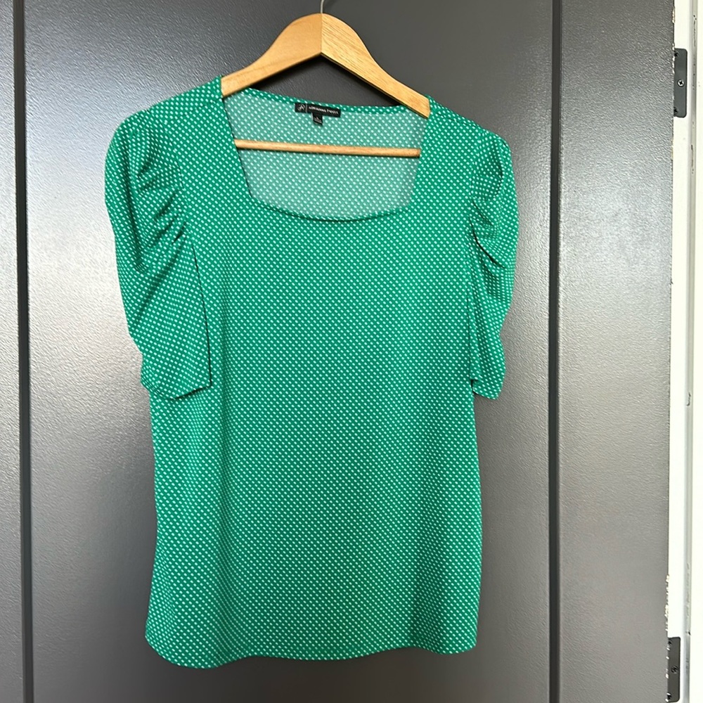 Kelly green polka dot top.